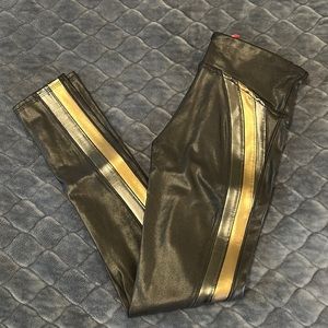 Spanx faux leather legging with metallic grey and gold stripe down the leg.